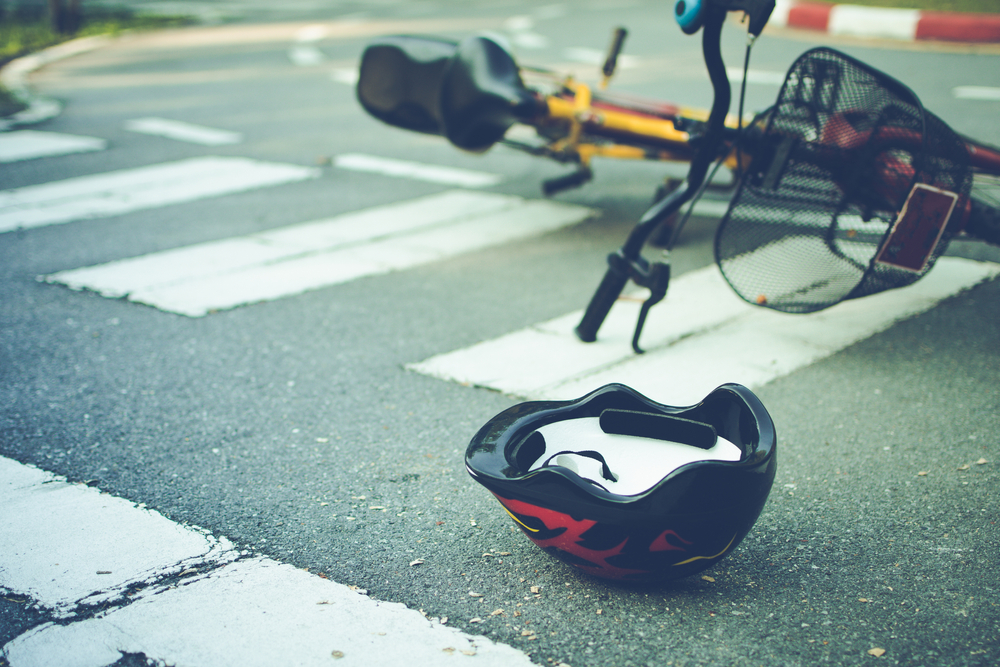 Bicycle and helmet on the ground at a Worcester MA crosswalk accident scene