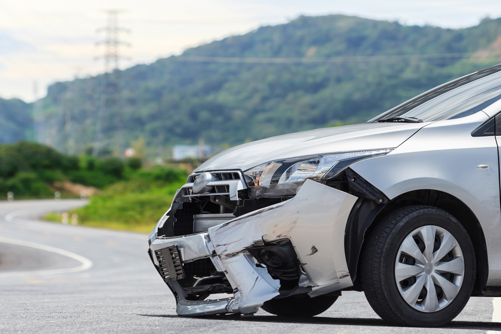 Front-end vehicle damage after a car accident, illustrating the aftermath of a Massachusetts hit-and-run collision