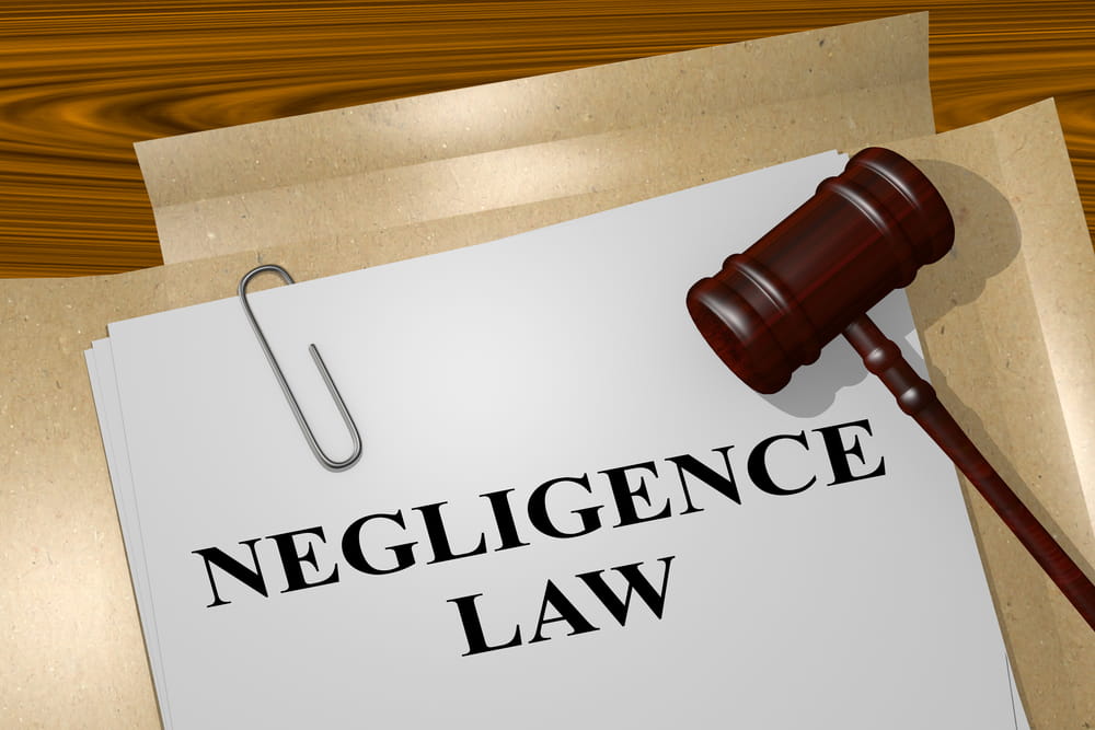 Negligence law concept showing legal document and gavel related to Massachusetts personal injury cases