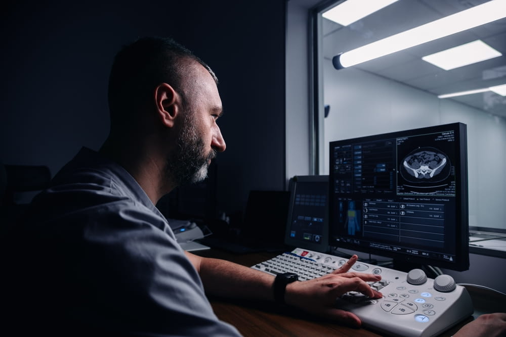 Doctor reviewing medical imaging related to pre-existing condition injury claim