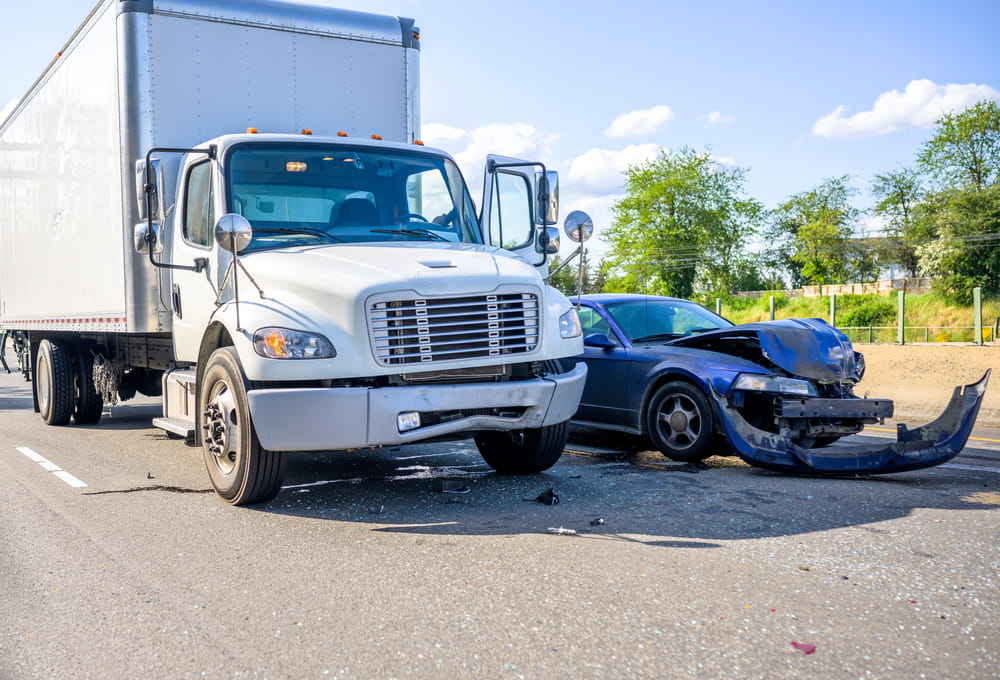 Collision involving a rental box truck and passenger vehicle on a Massachusetts roadway